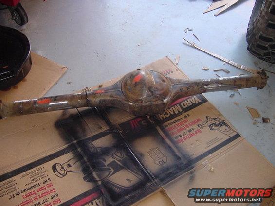 Rear axle assembly on cardboard with "Yard Machines" box