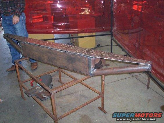 Custom metal fabrication part on stand