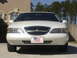 1997 Lincoln Mark VIII - Front view of a white 1997 Lincoln Mark VIII with an American flag license plate.