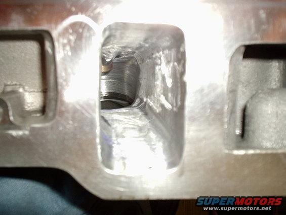 picture2-036.jpg Here is the Intake ports, you can see that they have been opened up aswellas Gasket matched. These ports arnt polished for one simple reason, turbulance is a good thing for intake, you want your fule to Atomize as much as possible. All the porting and polishing was done by yours truely. If you want any advice or what tools to use or just how to do it, ask me. Ill be happy to anser ANY questions.