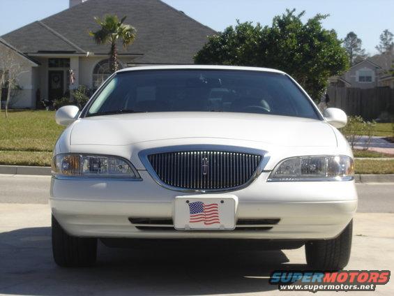 Front view of a white 1997 Lincoln Mark VIII parked in a driveway