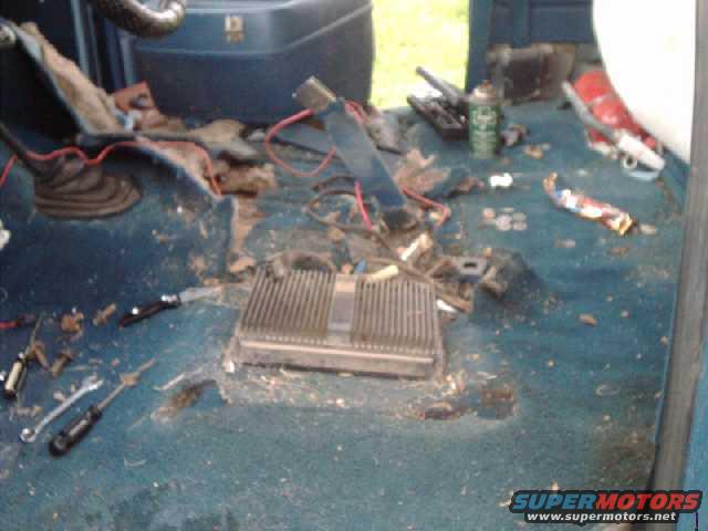 First remove seats, seatbelt anchors, console, stereo amps, CB, etc. Found $2.59 in change!