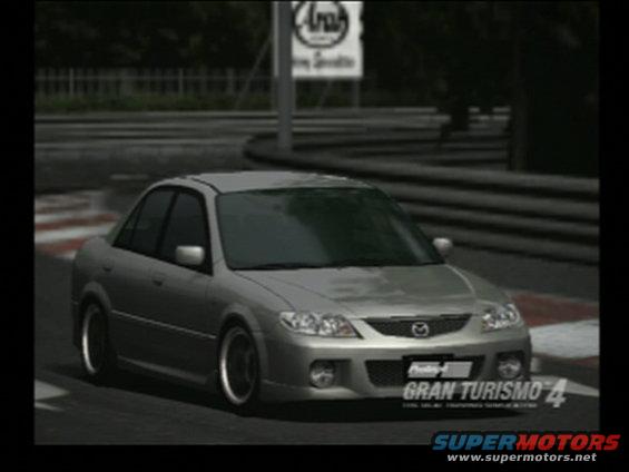 Silver sedan on a race track, likely from a video game