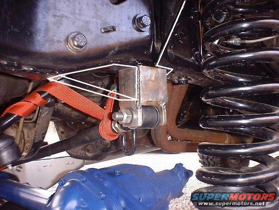 Suspension part with red strap and coil spring
