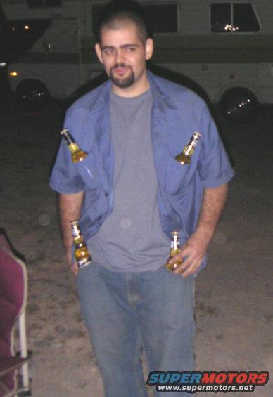 Man with four beer bottles tucked into his shirt and pockets