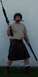 1990 Ford Bronco - Man poses with firearms and a knife in his mouth, wearing a kilt.