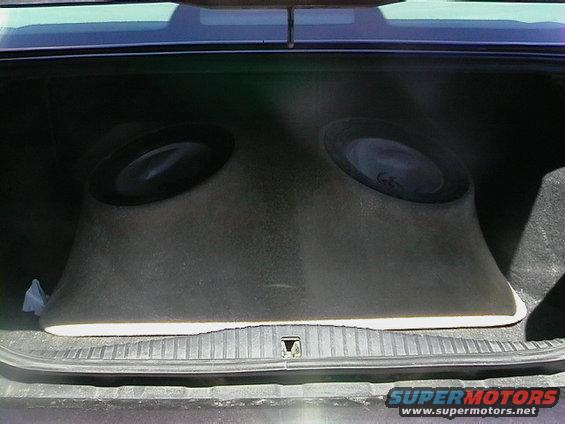 Car trunk interior showing a custom dual subwoofer enclosure