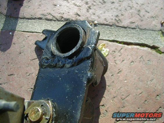 Black suspension part with a hollow cylindrical opening