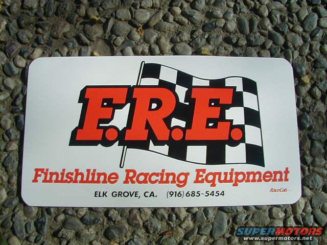 Finishline Racing Equipment sign with checkered flag and phone number