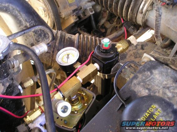 p1010383.jpg Output systems. The part #s listed are for Grainger. Top to bottom going down and across to the lower left: Colessing filter(4ZL23), gauge, pressure switch (5B419), air hose adapter thing, pop off valve (6D915).