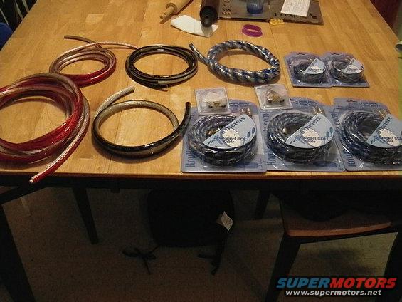 Car audio cables and connectors on a wooden table