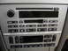 2002 Lincoln Town Car - Close-up of a car's center console, showing the audio system and climate control panel.