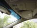 2002 Lincoln Town Car - The interior of a car is visible, including the rearview mirror and overhead console.