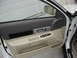 2002 Lincoln Town Car - Close-up view of the interior door panel, showing the door handle, window controls, and storage compartment.