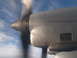 1988 Ford Bronco - Close-up of an airplane's engine nacelle and propeller in flight, with the sky visible in the background.