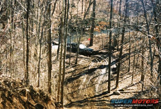 1995 Ford Bronco on wooded trail