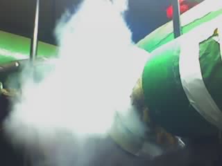 Smoke machine emitting a large cloud of white smoke