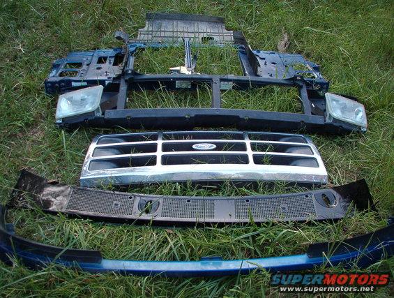 frontparts1.jpg Front clip parts from 96 EB Bronco.  Headlights, wiper valance, & passenger fender available; hood missing. SOLD Headlight doors, grille, bumper valance, header panel, & core support.