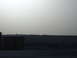 1988 Ford Bronco - Utility boxes are visible in the foreground with a hazy landscape in the background.