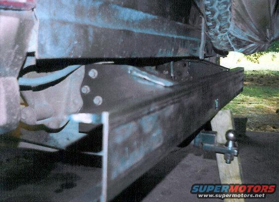 I designed & built the rear bumper to bolt on using only the factory holes in the frame & the ones from the aftermarket receiver on the bottom of the frame rails.  The front bumper uses only factory holes.  The basic structure of this & my first front bumper is 3 pieces of hot-rolled C-channel.

[url=http://www.supermotors.net/registry/media/182678][img]http://www.supermotors.net/getfile/182678/thumbnail/bumper-junk.jpg[/img][/url] . [url=http://www.supermotors.net/vehicles/registry/media/65184][img]http://www.supermotors.net/getfile/65184/thumbnail/chassis_tank_l.jpg[/img][/url]

This bumper ended up weighing ~180# empty (when it was on the '83 frame).

[url=http://www.supermotors.net/registry/media/932169][img]http://www.supermotors.net/getfile/932169/thumbnail/rearofh.jpg[/img][/url]

See the NEXT few pics...