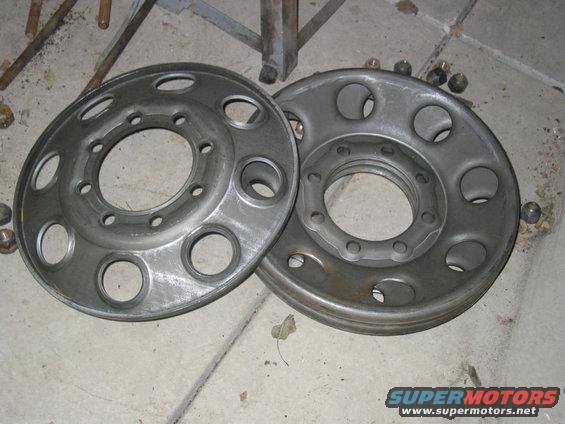 These are 3/8" thick stamped modular centers from a major wheel manufacturer. They fit tight against the lip inside the Hummer rim. This makes it real easy to center and square the center to the rim for welding.