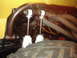 1978 Ford Bronco - Close-up view of the front suspension components and tire of a vehicle.