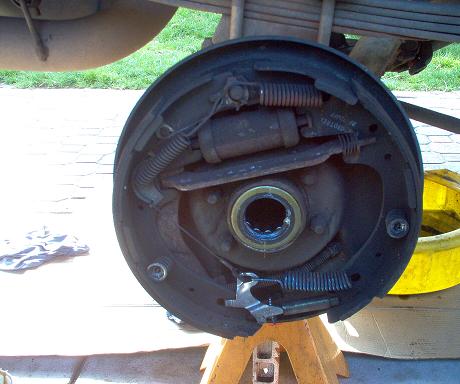 Rear drum brake assembly with visible part numbers