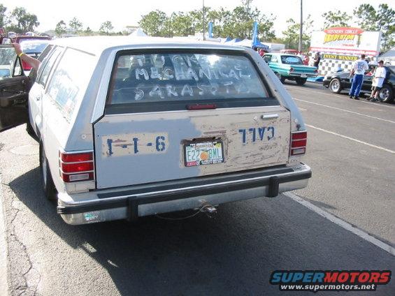 station wagon with writing on rear window and license plate E22 BML