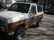 1986 Ford Bronco II - This 1986 Ford Bronco II is parked on a street with another vehicle in the background.