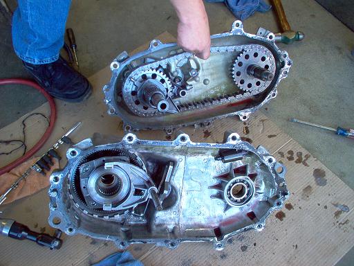 Disassembled transfer case with gears and chain