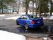 2003 Mazda Protege - This blue 2003 Mazda Protege is shown from the rear three-quarter angle, with its license plate clearly visible.
