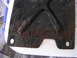 1994 Ford Bronco - This heavily rusted metal bracket shows significant corrosion and wear.