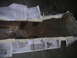 1994 Ford Bronco - A rusted metal part is covered with newspaper and masking tape, likely for protection or preparation.