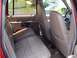 1992 Ford Explorer - The tan leather interior of a 1992 Ford Explorer, the rear seats and a view towards the driver's area.