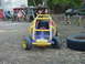 1969 Ford Bronco - A child's toy dune buggy is parked in an outdoor area with various items in the background.