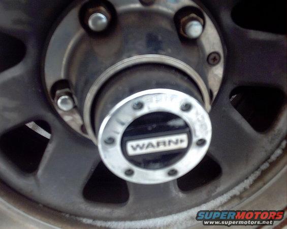 Wheel hub with WARN branding, close-up view