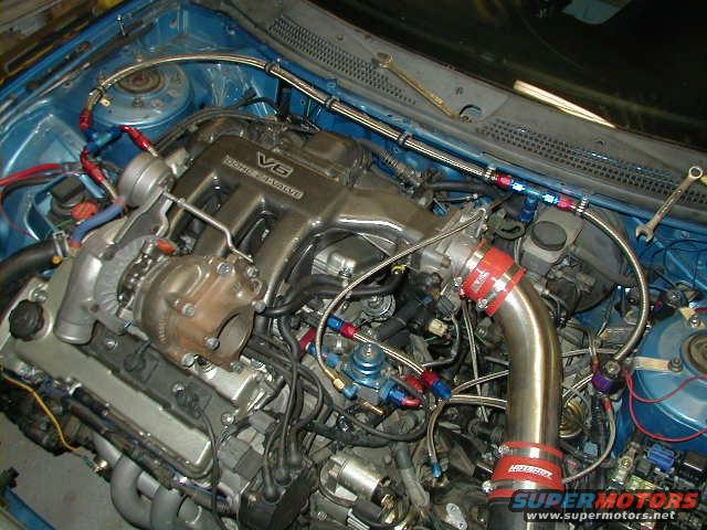 Engine bay with turbocharger and V6 intake manifold