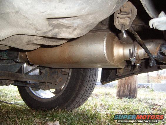 Exhaust system and tire from underneath a vehicle