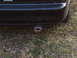 1993 Ford Probe - Close-up of a car's rear bumper and exhaust pipe, with 'FLOWMASTER' branding visible.