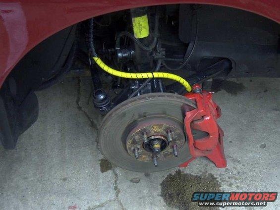 brake-hose-with-mount-removed-and-tied-to-the-.jpg 