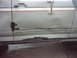 1990 Ford Bronco - This 1990 Ford Bronco shows significant rust and damage on its side door.