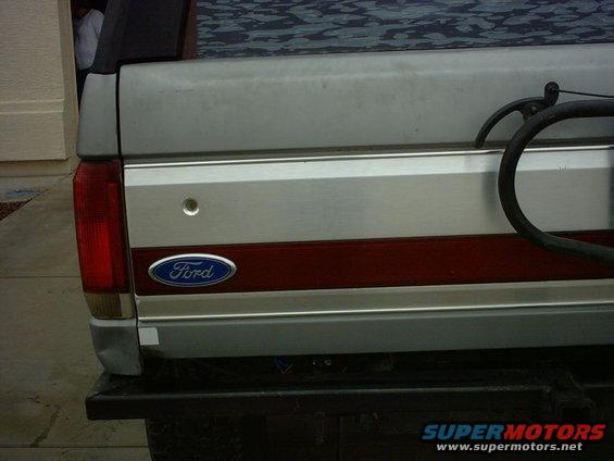 1990 Ford Bronco rear tailgate with Ford oval badge and red stripe detail