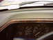 1990 Ford Bronco - Interior view of a 1990 Ford Bronco, showing the dashboard with wood grain trim and instrument cluster.