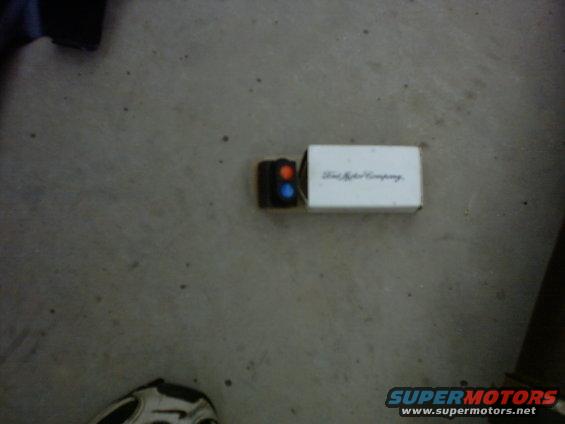 Ford Motor Company emblem on a box with red and blue lights
