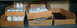 2000 Ford Mustang - Several cardboard boxes filled with various small parts are organized on metal shelving units.