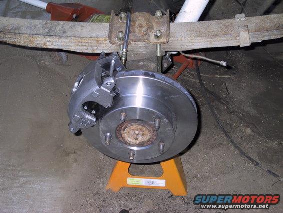 img_0121.jpg passengers side complete, used 78 f150 front rotors, had to put little spaces over the studs to keep the rotor centered properly. Using 86 suburban calipers and hoses with self made lines, and a 77 lincoln towncar master cyclinder