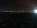 1988 Ford Bronco - The image shows an airport scene at night with runway lights and a control tower illuminated.