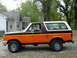 1988 Ford Bronco - This two-tone Ford Bronco features a prominent Harley-Davidson decal on its side.