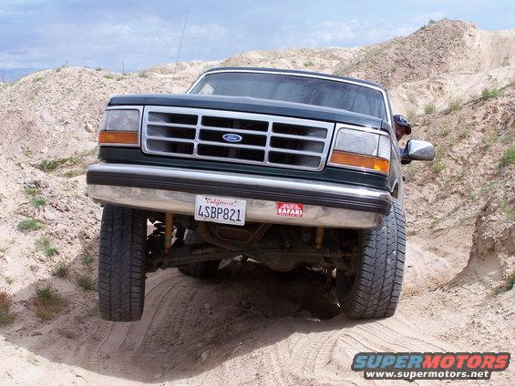1993 Ford Bronco front view, dark green, off-roading