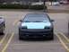 1993 Ford Probe - This 1993 Ford Probe features a distinctive light blue hood contrasting with its black body and pop-up headlights.